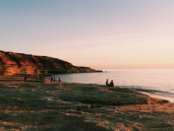 Scenic view of sea at sunset