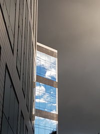 Low angle view of skyscraper against sky