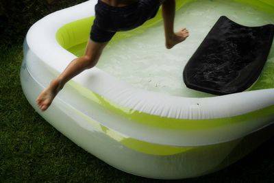 High angle view of woman playing in swimming pool