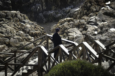 High angle view of boy standing on steps