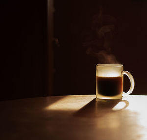 Coffee on table in darkroom