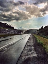 View of road against cloudy sky