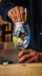 Cropped hand of man holding wineglass