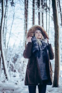 Young woman in forest during winter