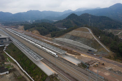 High angle view of railroad tracks against mountains