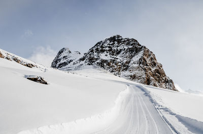 Snow covered mountain against sky