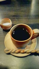 Close-up of coffee cup on table