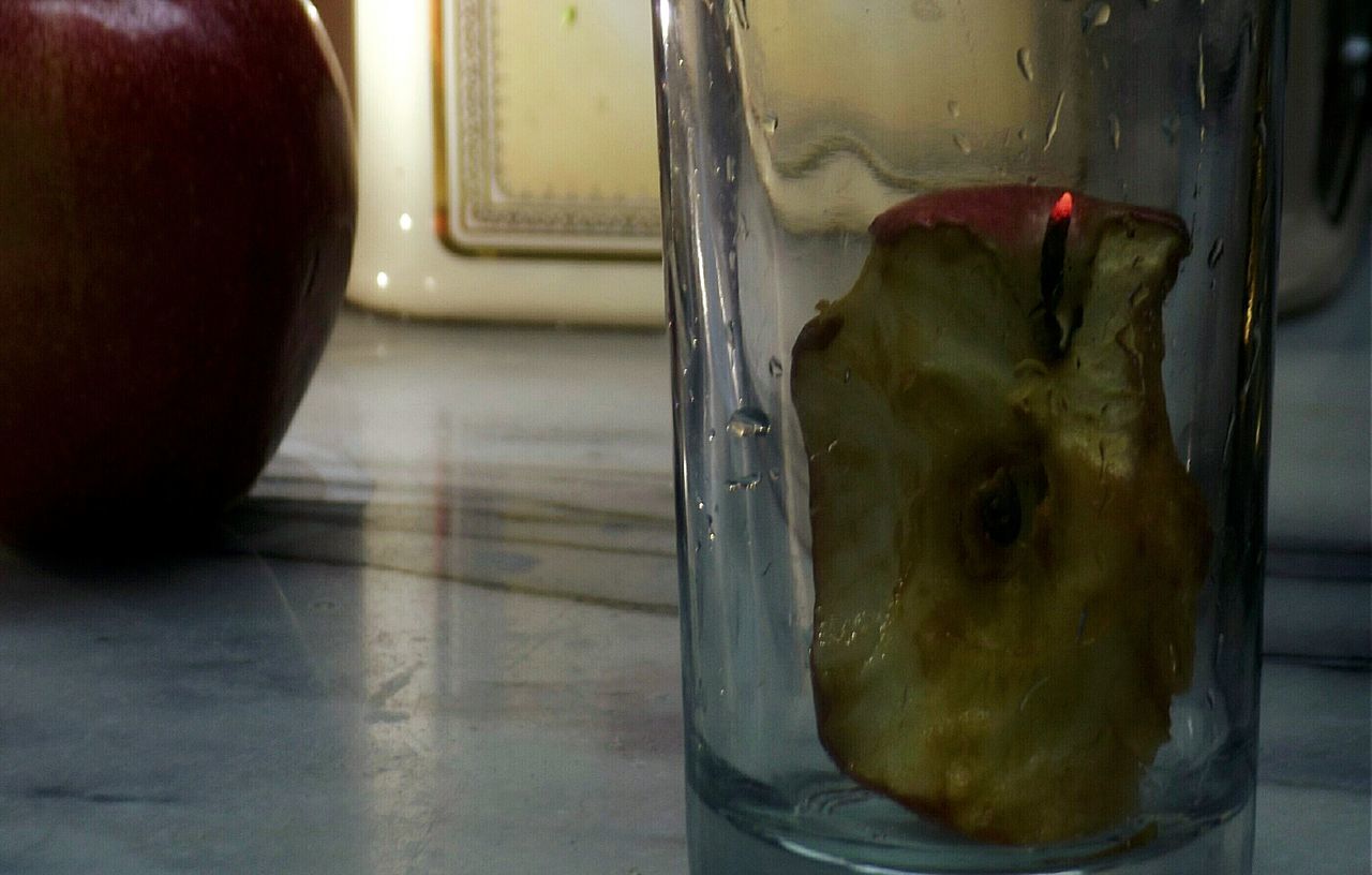 indoors, window, glass - material, close-up, food and drink, transparent, still life, focus on foreground, food, table, glass, no people, reflection, day, freshness, window sill, animal themes, red, home interior, metal