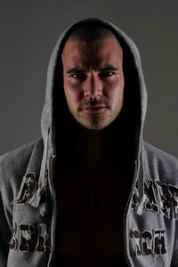 Portrait of sweating man against gray background