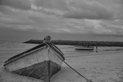 Boat on beach against sky