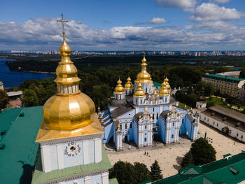 Temple against buildings in city