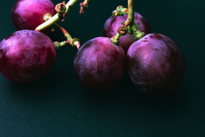 Close-up of fruits against black background