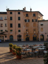 Facade of building with windows in background