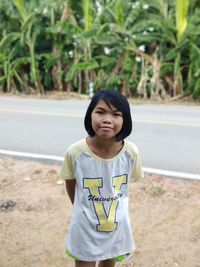 Portrait of girl standing outdoors