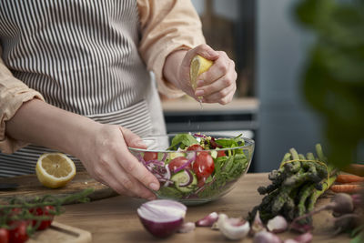 Midsection of man preparing food