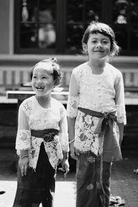 Portrait of smiling girl standing outdoors