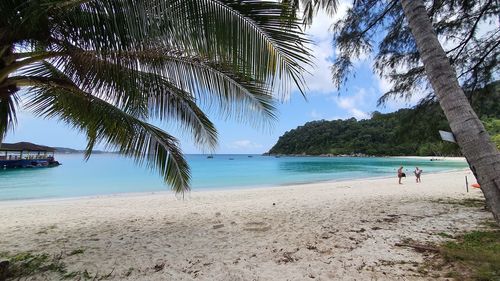 Scenic view of beach against sky at perhentian island, malaysia