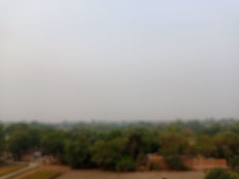 Scenic view of field against clear sky