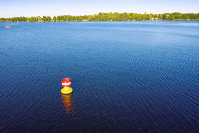 High angle view of buoy floating on sea