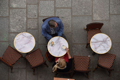 People sitting at sidewalk cafe