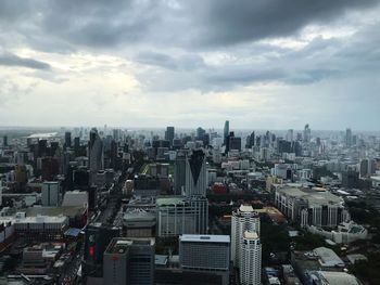 High angle view of buildings in city against sky