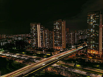 High angle view of illuminated city buildings at night