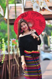 Portrait of beautiful woman standing on land