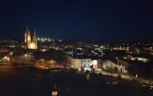 Illuminated cityscape at night