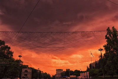 Low angle view of buildings at sunset