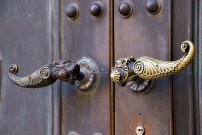 Close-up of closed door handles