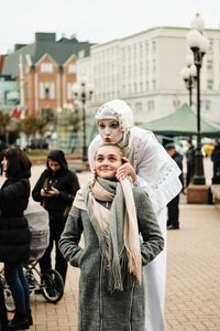 People standing on street in city during winter