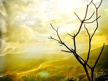 Scenic view of landscape against cloudy sky