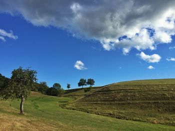 Scenic view of landscape against cloudy sky