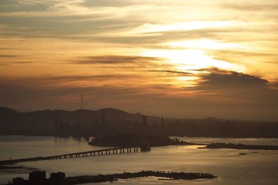 Scenic view of sea against orange sky