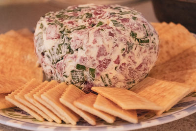 Close-up of bread in plate on cutting board