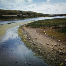 Scenic view of beach against sky