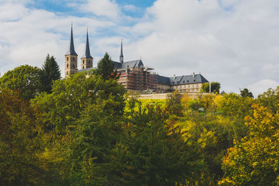 View of trees and buildings against sky