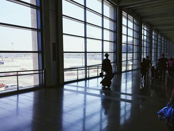 Silhouette people waiting at airport