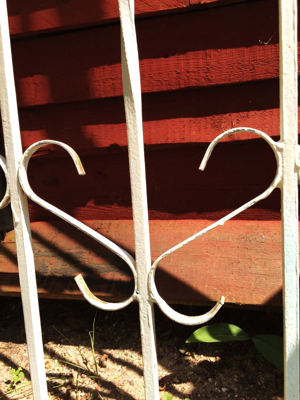 close-up, metal, protection, wood - material, day, outdoors, no people, fence, sunlight, safety, wooden, pattern, red, absence, wood, chair, shadow, grass, plant, security