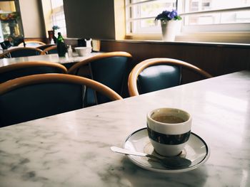 Coffee cup on table in cafe