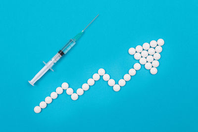 High angle view of decoration on blue background