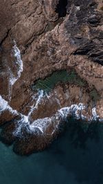 High angle view of rock formation in sea