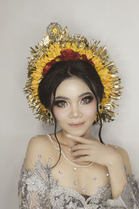 Portrait of young woman in balinese traditional wedding dress