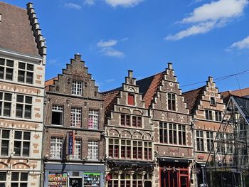 Low angle view of building against blue sky