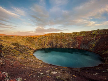 Scenic view of lake against sky during sunset