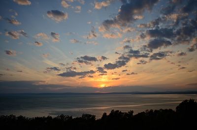 Scenic view of silhouette landscape against sky at sunset