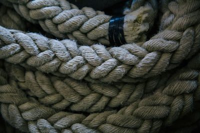 Close-up of coiled up rope in boat