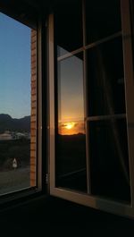 Sunset seen through window