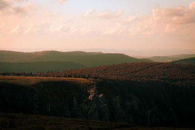 Scenic view of landscape against sky during sunset