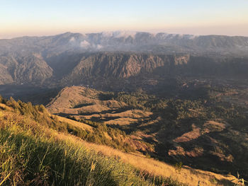 Scenic view of landscape and mountains against sky